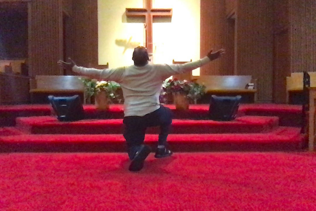 Kneeling down before the altar